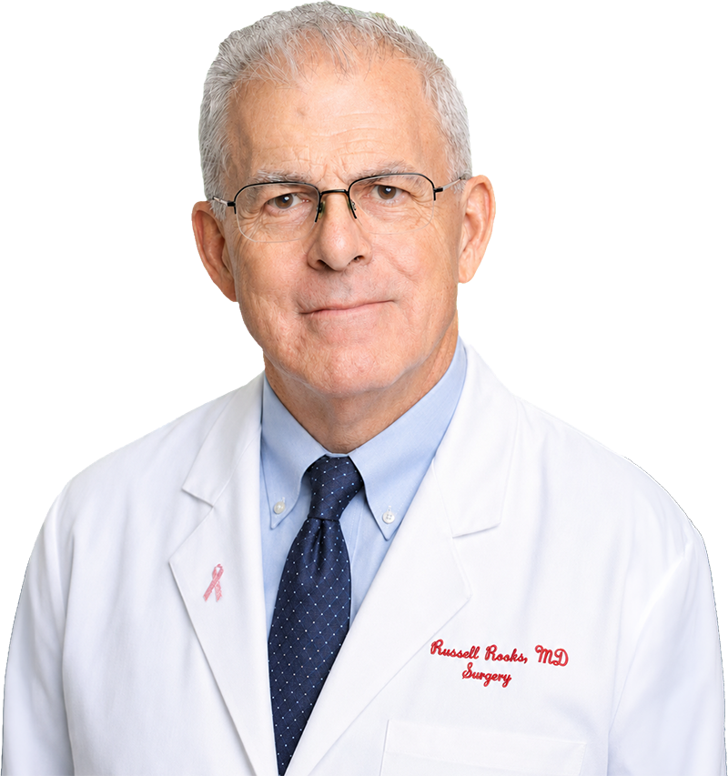 Portrait of James R. Rooks, MD, FACS, in a white coat