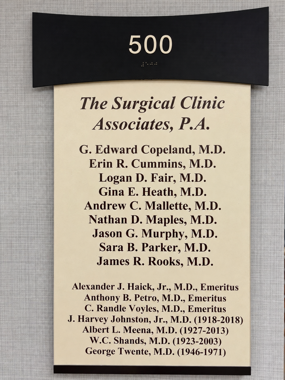 The office sign for The Surgical Clinic Associates, P.A., listing the practice's current surgeons and emeritus physicians